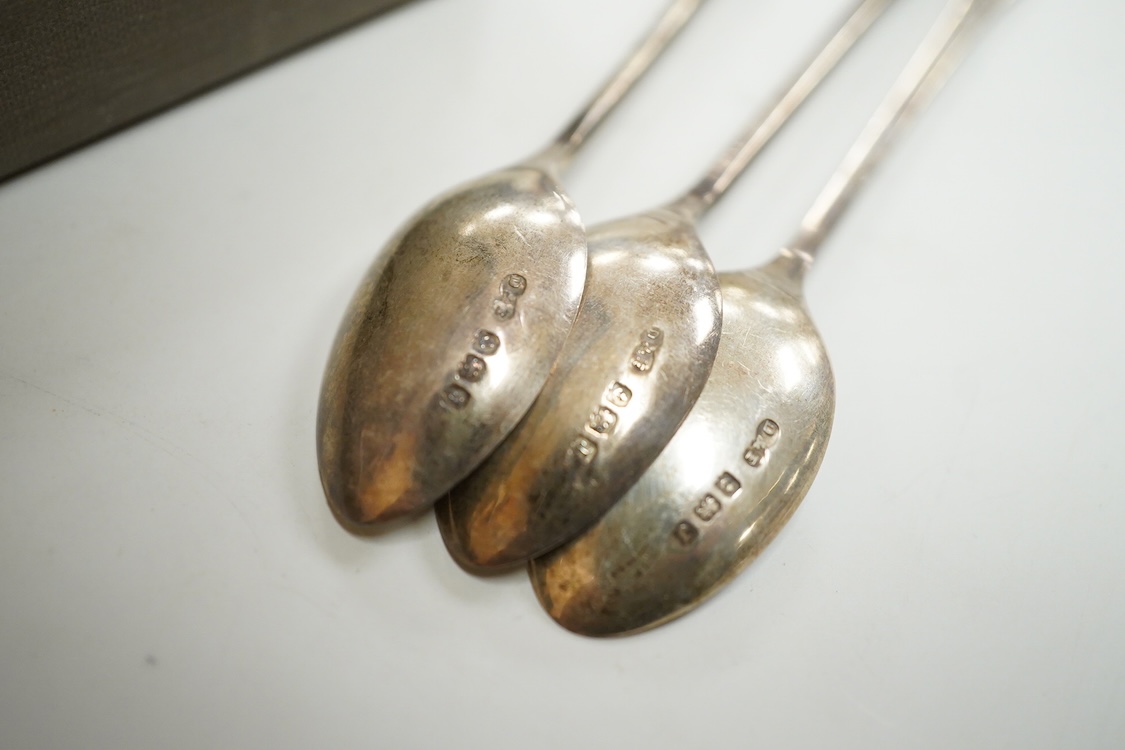 A cased set of silver Norwegian gilt 925 and polychrome enamelled coffee spoons(a.f.), 93mm, together with a set of six George V silver coffee spoons, with enamelled terminals, Deakin & Francis, Birmingham, 1933.